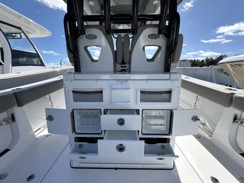 Slide: The Image of 2025 Sportsman Open 282 boat interior with storage compartments and seating. - 36