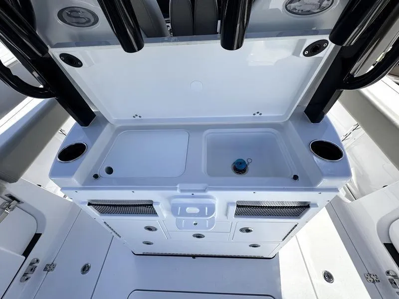 Slide: The Image of 2025 Sportsman Open 282 boat interior with storage and sink. - 37