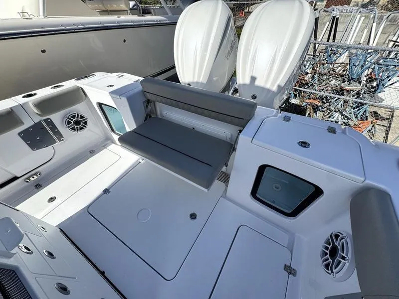 Slide: The Image of 2025 Sportsman Open 282 boat interior with seating and dual engines. - 40