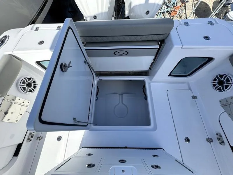 Slide: The Image of 2025 Sportsman Open 282 boat interior with open storage compartment and seating. - 41
