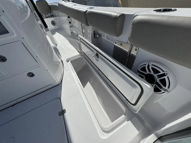 Slide: The Image of 2025 Sportsman Open 282 boat interior with storage compartment and seating. - 42