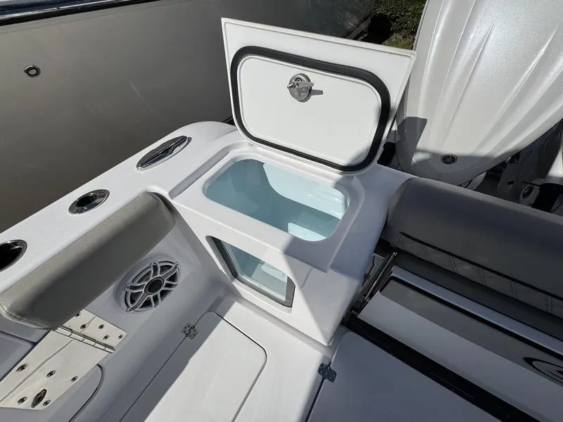 Slide: The Image of 2025 Sportsman Open 282 boat with open storage compartment and seating area. - 43
