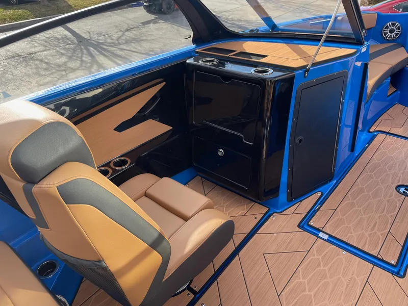 Slide: The Image of Interior of 2025 Yamaha Boats 222XE, featuring sleek seating and modern design elements. - 9