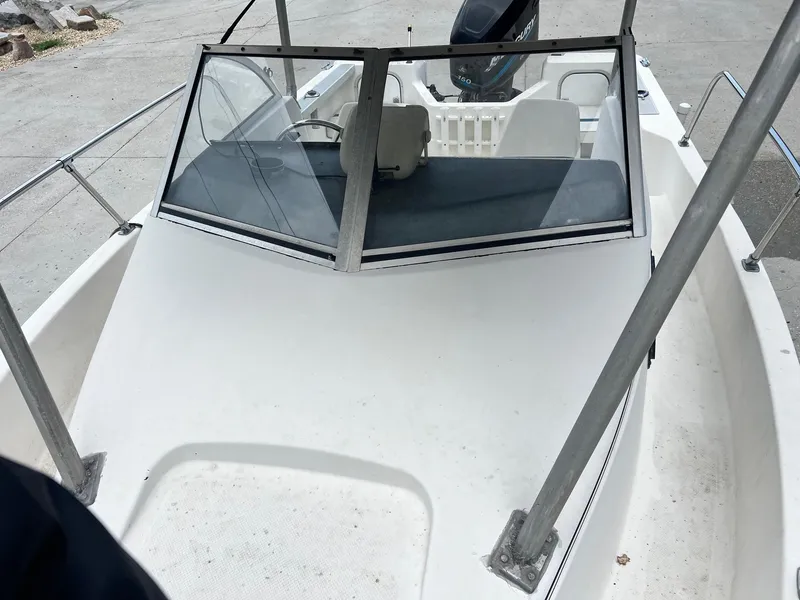 Slide: The Image of 1997 Bayliner 1802 FJ boat on trailer at The Boat Yard dealership. - 7