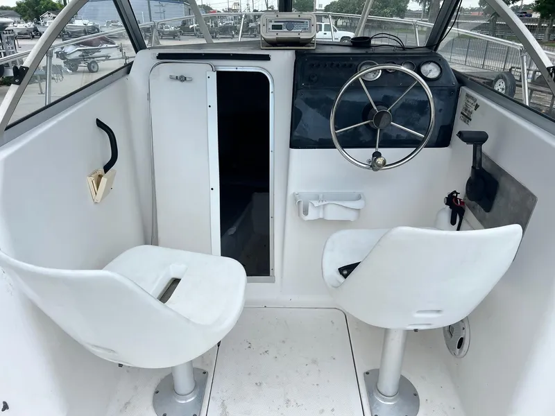Slide: The Image of Interior of 1997 Bayliner 1802 FJ boat with cushions, ropes, and life jackets. - 9
