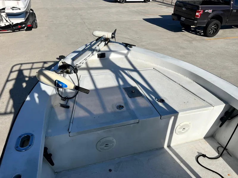 Slide: The Image of 2011 Gravois 22 Bay boat deck with trolling motor in parking lot. - 11