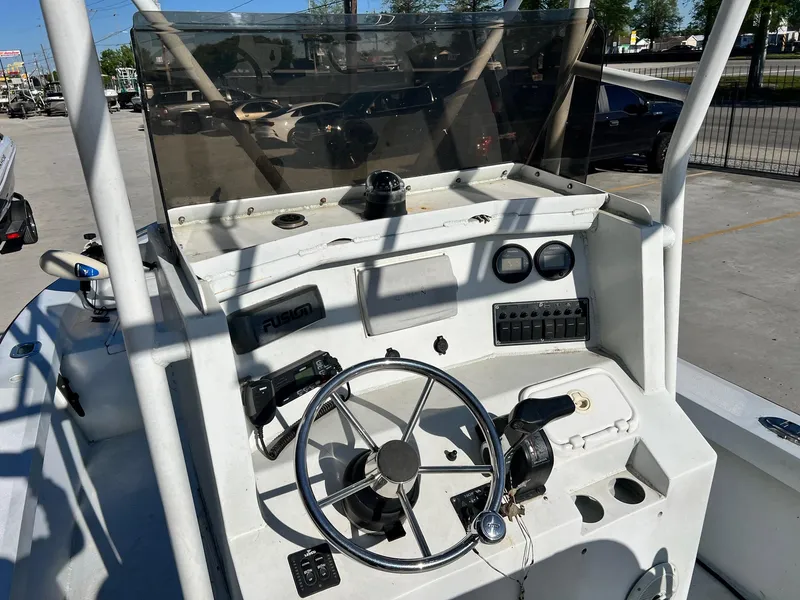 Slide: The Image of 2011 Gravois 22 Bay boat dashboard with steering wheel and controls. - 4