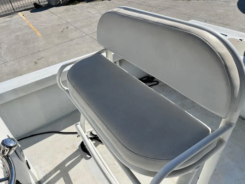 Slide: The Image of 2011 Gravois 22 Bay boat seat with gray upholstery in sunlight. - 5