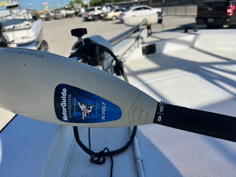 Slide: The Image of MotorGuide trolling motor on 2011 Gravois 22 Bay boat in parking lot. - 6