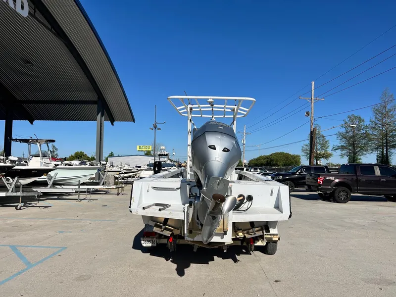 Slide: The Image of 2011 Gravois 22 Bay boat with outboard motor in a parking lot. - 8