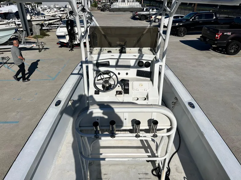 Slide: The Image of 2011 Gravois 22 Bay boat interior with steering console and rod holders. - 9