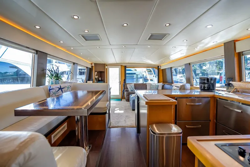 Slide: The Image of Luxurious interior of 1989 Hatteras 65 Enclosed Bridge yacht with modern amenities. - 16