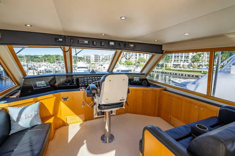 Slide: The Image of Interior of 1989 Hatteras 65 Enclosed Bridge yacht with helm and panoramic windows. - 22