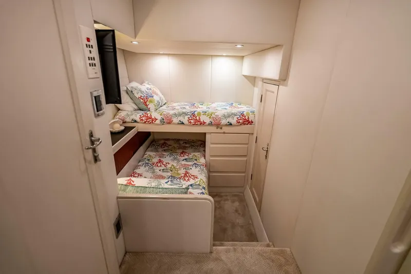 Slide: The Image of Cozy cabin with bunk beds in 1989 Hatteras 65 Enclosed Bridge yacht. - 32