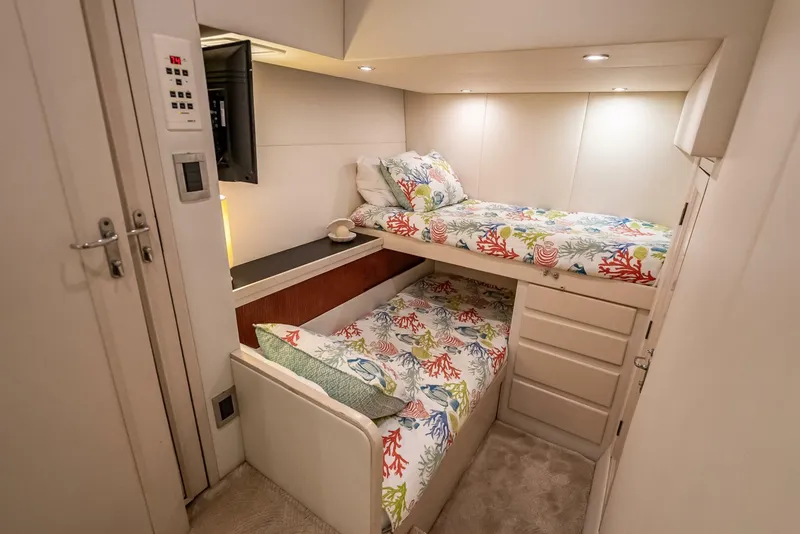 Slide: The Image of Cozy cabin with twin beds in 1989 Hatteras 65 Enclosed Bridge yacht. - 33