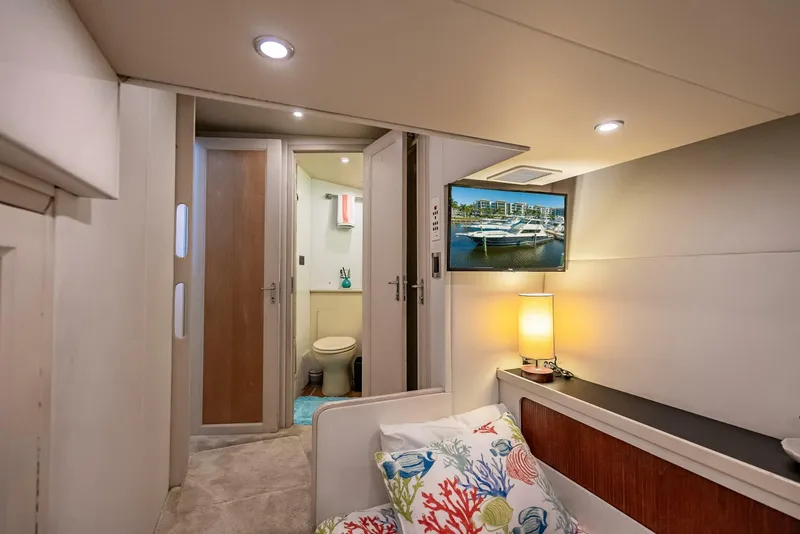 Slide: The Image of Interior of 1989 Hatteras 65 Enclosed Bridge yacht with cozy cabin and modern amenities. - 34