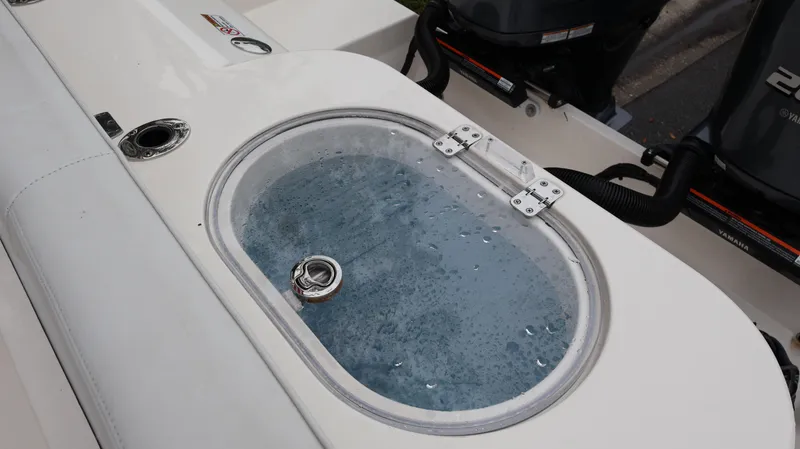 Slide: The Image of Livewell on 2023 Cobia 280 Center Console boat, filled with water. - 27