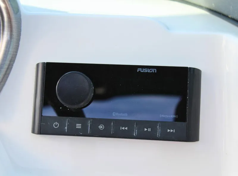Slide: The Image of Fusion Bluetooth audio system on 2024 NauticStar DC Deck boat. - 16