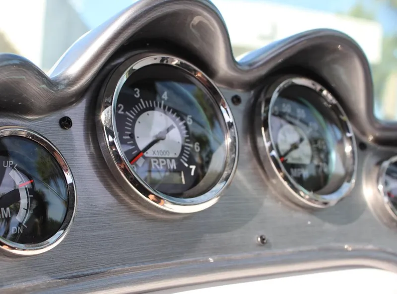 Slide: The Image of Close-up of 2024 NauticStar DC Deck boat dashboard gauges. - 18