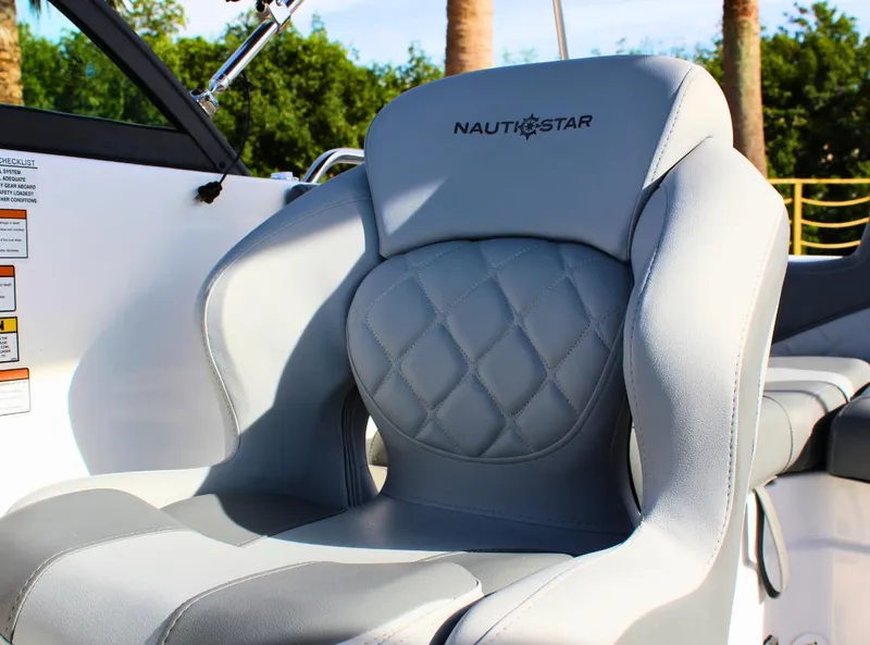 Slide: The Image of 2024 NauticStar DC Deck boat seat with quilted design and logo. - 19