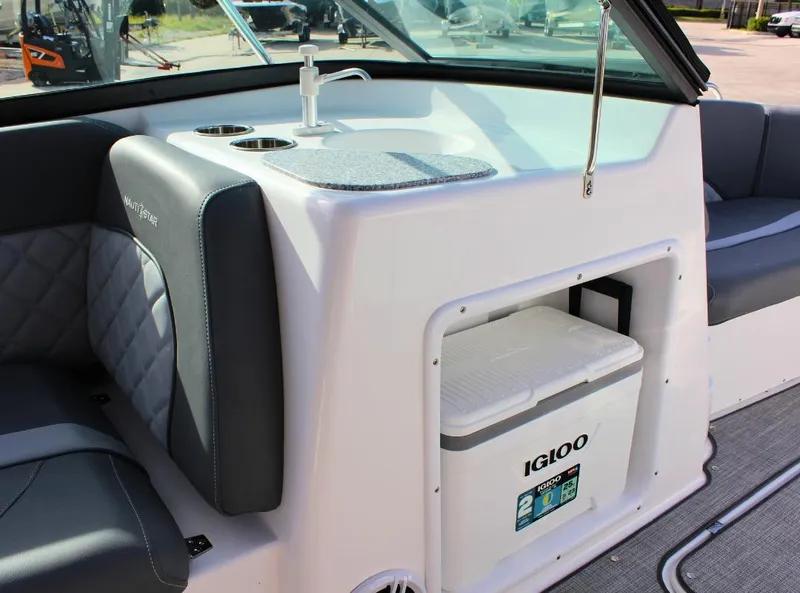 Slide: The Image of 2024 NauticStar DC Deck boat interior with Igloo cooler and seating. - 22