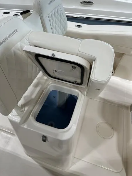 Slide: The Image of 2025 Grady-White Fisherman 236 boat interior with open storage compartment. - 19