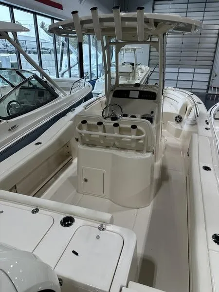 Slide: The Image of 2025 Grady-White Fisherman 236 boat interior with center console and seating. - 6