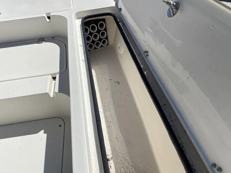 Slide: The Image of Open storage compartment on 2013 ShearWater 25LTZ boat. - 10