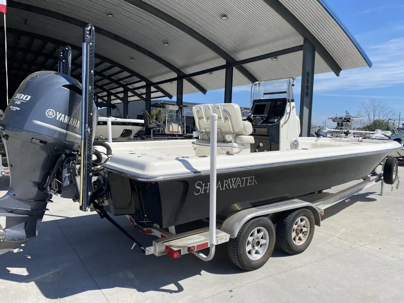 Slide: The Image of 2013 ShearWater 25LTZ boat with Yamaha 300 V6 engine on trailer. - 16