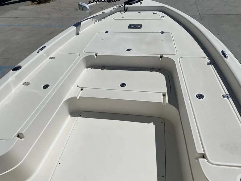 Slide: The Image of 2013 ShearWater 25LTZ boat deck with storage compartments and clean design. - 23
