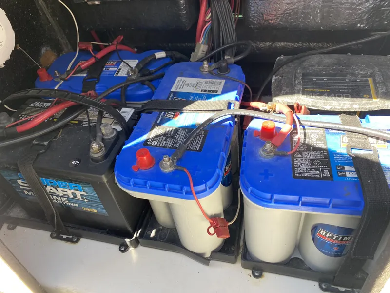 Slide: The Image of Boat battery compartment with multiple marine batteries in a 2013 ShearWater 25LTZ. - 27