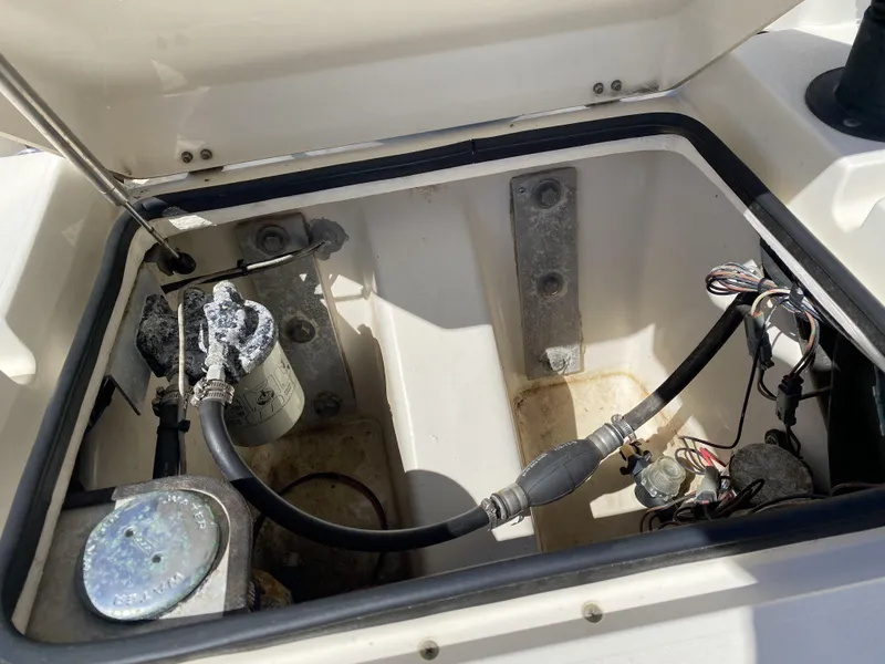 Slide: The Image of Open compartment of 2013 ShearWater 25LTZ boat showing internal components and wiring. - 29