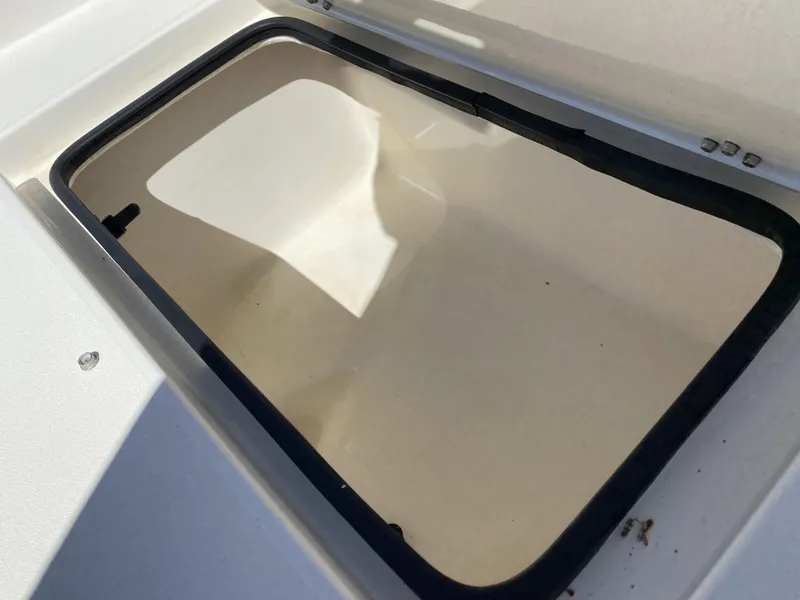 Slide: The Image of Hatch cover on 2013 ShearWater 25LTZ boat, open and empty. - 30
