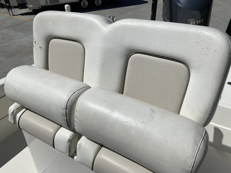 Slide: The Image of ShearWater 25LTZ 2013 boat seat with white upholstery and padded backrest. - 31