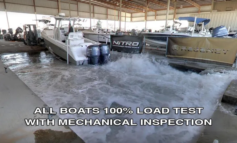 Slide: The Image of 2013 ShearWater 25LTZ boat undergoing load test and mechanical inspection in a warehouse. - 33