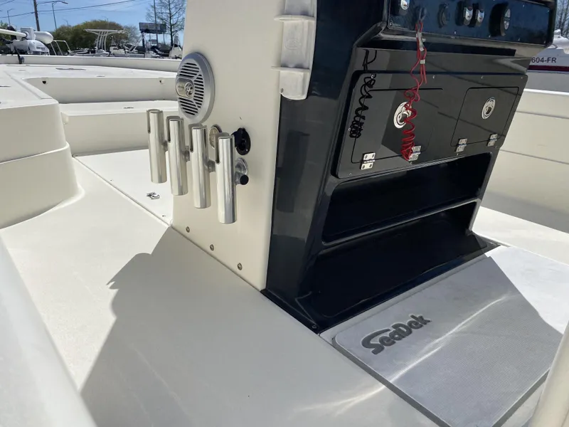 Slide: The Image of 2013 ShearWater 25LTZ boat console with rod holders and SeaDek flooring. - 6