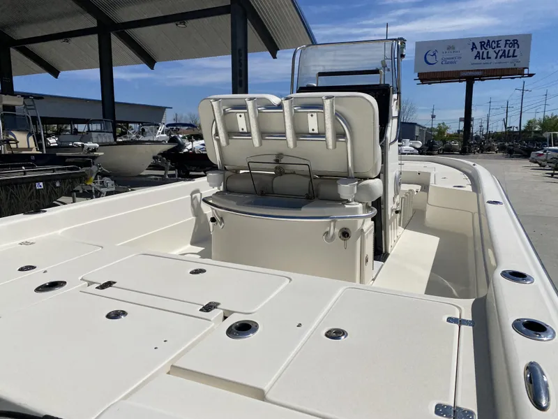 Slide: The Image of 2013 ShearWater 25LTZ boat interior with seating and storage compartments. - 7