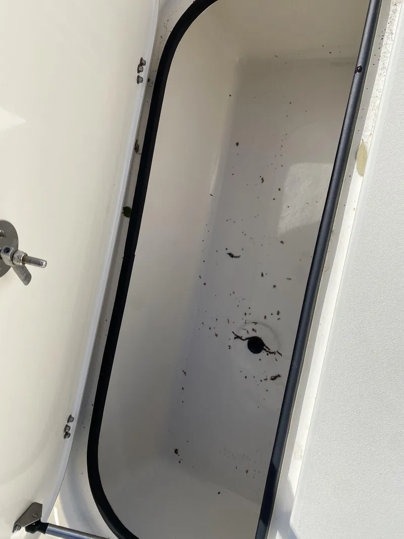 Slide: The Image of Open storage compartment in 2013 ShearWater 25LTZ boat. - 9