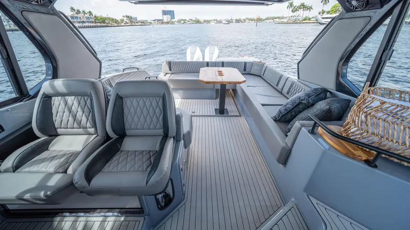 Slide: The Image of Luxurious interior of 2025 Hanover 387 Outboard boat with plush seating and scenic water view. - 17