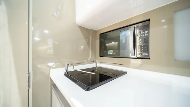 Slide: The Image of Modern kitchenette in 2025 Hanover 387 Outboard with stove and microwave. - 35