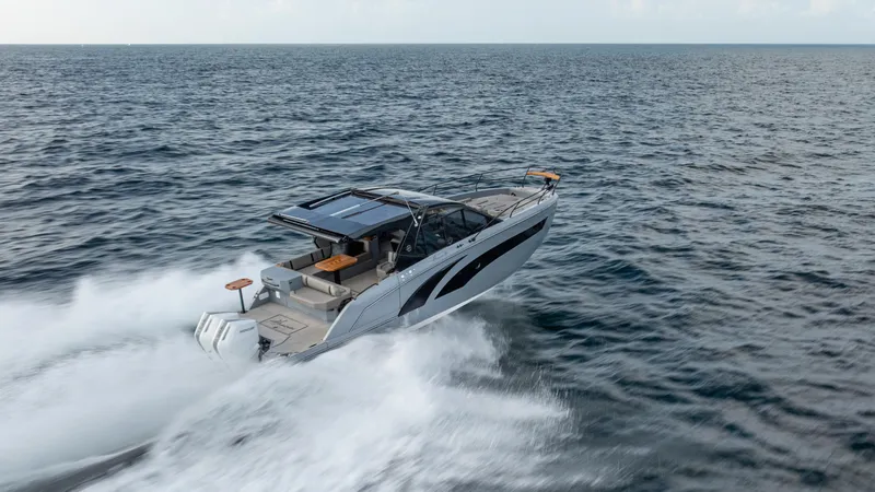 Slide: The Image of 2025 Hanover 387 Outboard speeding on open ocean waters. - 4