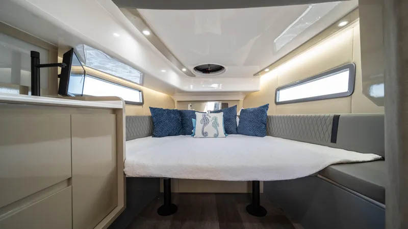 Slide: The Image of Luxurious interior of 2025 Hanover 387 Outboard boat with cozy bedding and modern design. - 42