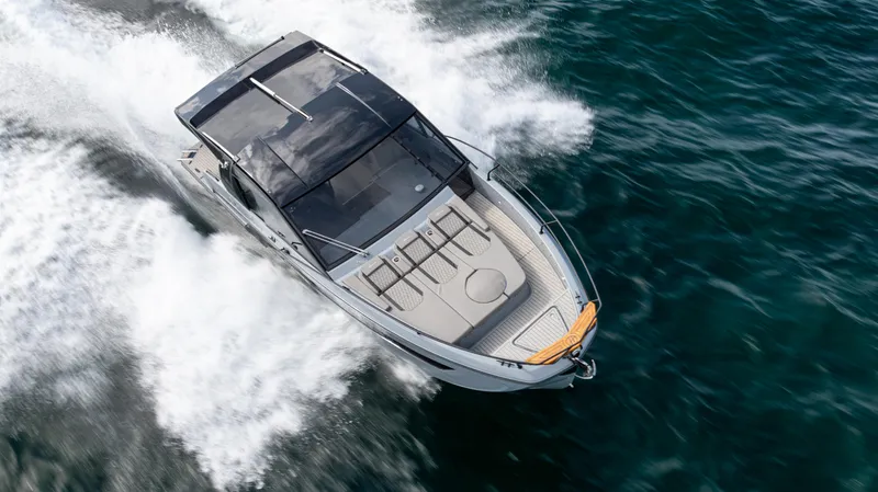 Slide: The Image of 2025 Hanover 387 Outboard boat cruising on open water, top view. - 7