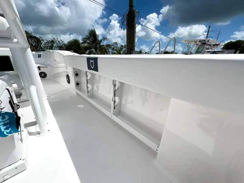 Slide: The Image of 2025 Sea Fox 248 Commander boat deck under a cloudy sky. - 21
