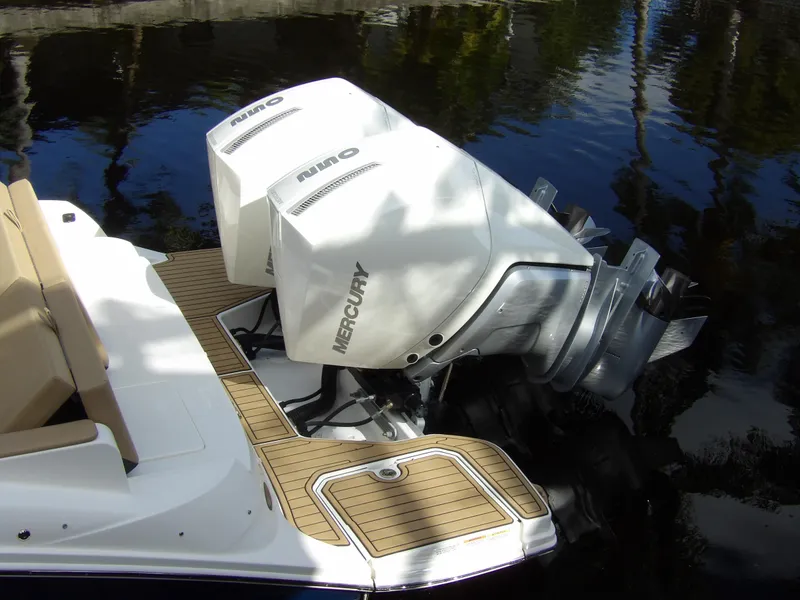 Slide: The Image of 2022 Sea Ray SDX 290 Outboard with twin Mercury engines on water. - 11