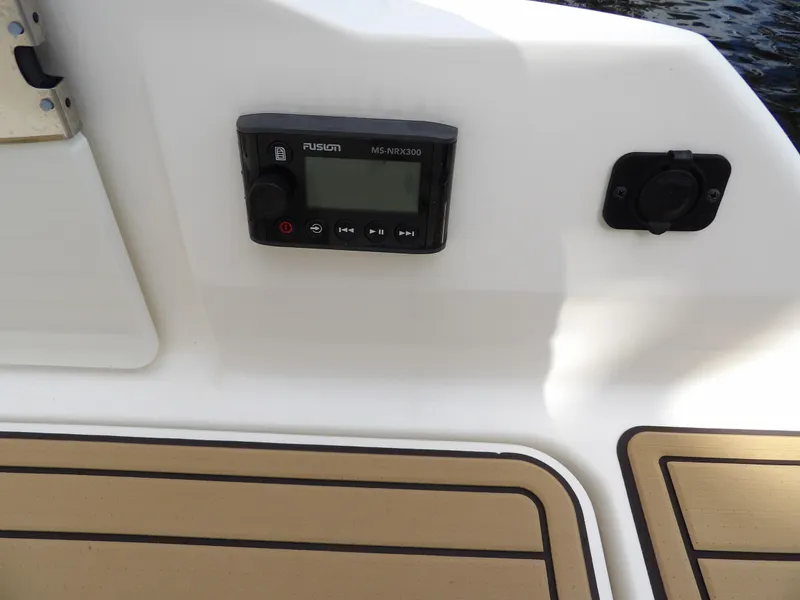 Slide: The Image of Control panel on 2022 Sea Ray SDX 290 Outboard boat deck. - 23