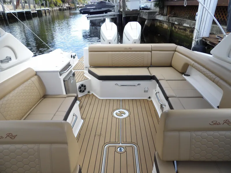 Slide: The Image of 2022 Sea Ray SDX 290 Outboard boat with spacious tan seating and sleek deck design. - 25