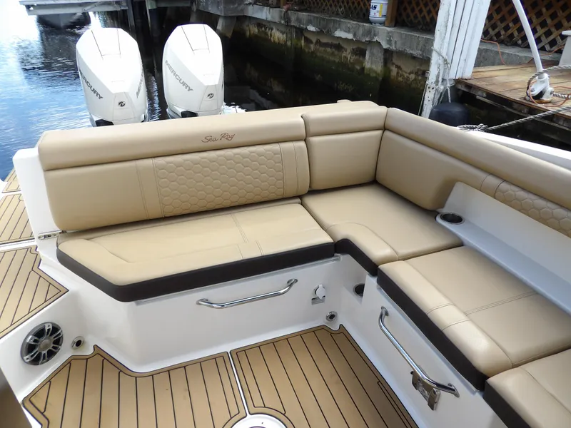 Slide: The Image of Luxurious seating on 2022 Sea Ray SDX 290 Outboard boat with twin engines. - 27
