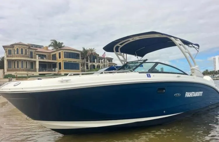 Slide: The Image of 2022 Sea Ray SDX 290 Outboard boat near luxury waterfront homes. - 3