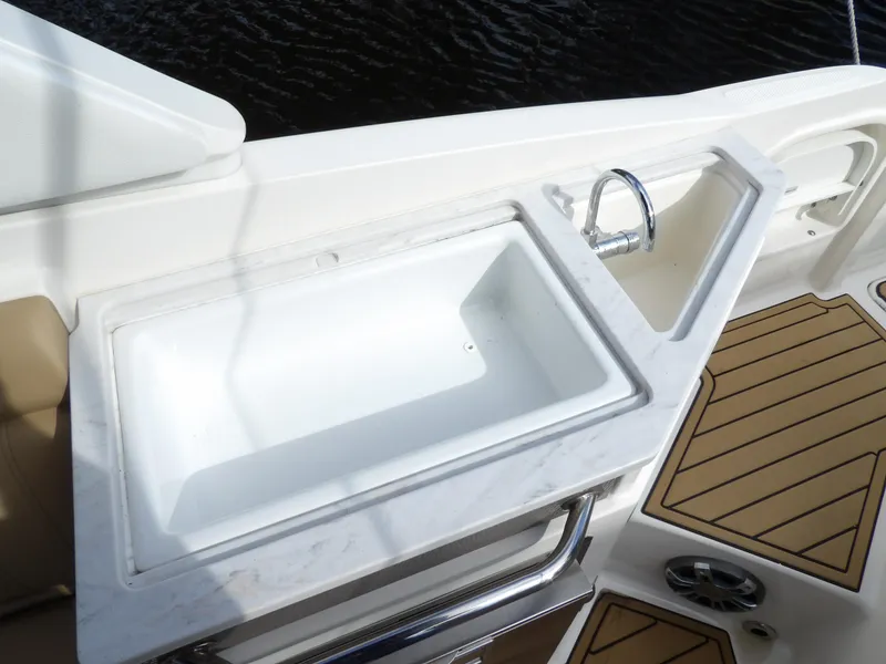Slide: The Image of 2022 Sea Ray SDX 290 Outboard boat sink and countertop detail. - 33
